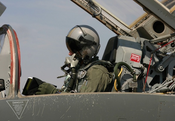 Fighter pilot getting ready to fly stock photo cropped-1